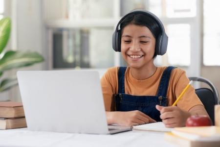 girl studying at laptop computer